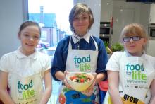 Picture of schoolchildren in Stoke learning aboard the Cooking Bus